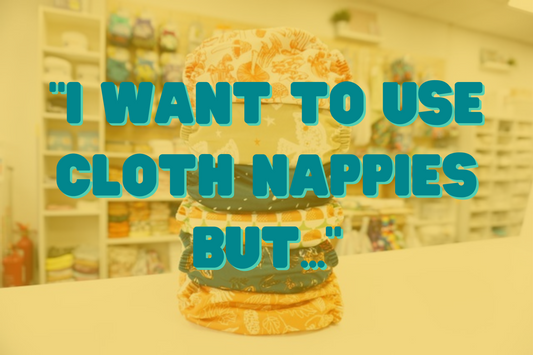 A stack of nappies in various patterns with the title "I want to use cloth nappies but..."